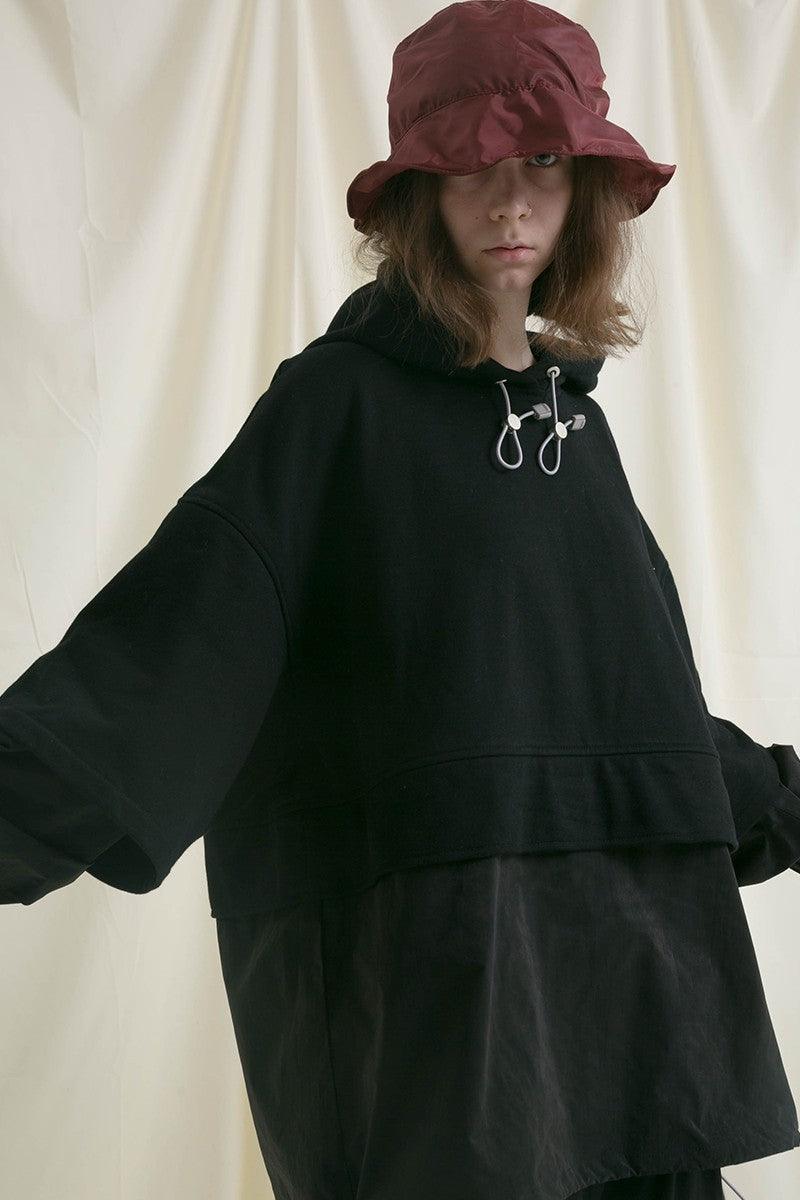 Center of Rotation Stitched Hooded Sweater
